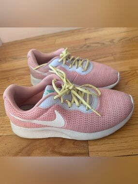 Nike Pink Mesh Sneakers with Yellow Laces and White Swoosh